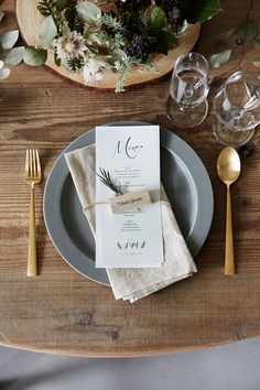 a place setting with silverware and napkins