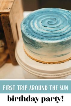 a blue and white cake with the words, first trip around the sun birthday party?