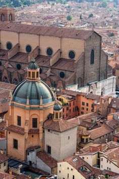 an aerial view of the city and its rooftops, with buildings in the foreground