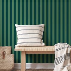 a green striped wallpaper with a bench and two wicker baskets on the floor