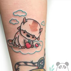 a small tattoo on the leg of a person with a hat and an apple in it