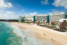 an aerial view of the resort and beach