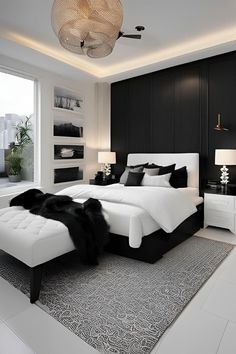 a black and white bedroom with a large bed