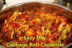 a close up of a pan of food with the words lazy day cabbage roll casserole