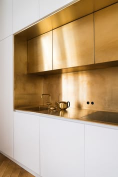 an instagram photo of a metallic kitchen