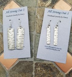 Hand stamped and formed sterling silver birch bark earrings.  They have been oxidized and tumbled in a special media to give them a matte finish.  You have a choice between the  Small - just under 2 inches long x 1/4 inch wide earrings or the Large - 2 1/8 inches long x 1/2 inch wide earrings.  They are very lightweight and will become your "go to" earrings! I was inspired by the many birch trees that line my back yard! Birch Bark Earrings, Birch Jewelry, Pebble Jewelry, Metal Jewelry Making, Patina Earrings, Tree Jewelry, Jewelry Nature, Metalwork Jewelry, Birch Bark