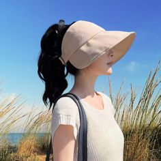 FREE Standard U.S Shipping on all orders over $35 Women's Sun Hat Ponytail - Wide Brim Bucket Hat with Ponytail Hole - Trendy Open Top Summer Hat - Perfect for Stylish Beach Looks 💕 These summer hats women are made of 100% cotton fabric, lightweight, breathable and comfortable to wear. Foldable Pony Tail Hat: packable and will fit your handbag when not in use, so you can bring this ponytail beach hat everywhere with you. Ponytail sun hat comes with removable wind proof rope / chin strap for windy days. This large sun hat will make nice shade for your face and neck! Ponytail bucket hat makes a unique gift for women. ONE SIZE: Head circumference 21.5 - 23 inch (56-59cm). Adjustable fit S M L Open Top Hat design - Friendly to curly hair, high ponytail hat, messy bun hat, high pony caps. Ship One Size Fits Most Brimmed Baseball Cap For Travel, Travel Baseball Cap, One Size Fits Most, Brimmed, Beach Visor Baseball Cap, Sun Hat With Uv Protection Baseball Cap, Adjustable Visor Baseball Cap For Travel, Beige Visor Bucket Hat For Travel, Uv Protection Baseball Sun Hat, Brimmed Visor For Outdoor Use, Wide Brim Baseball Cap For Summer Travel