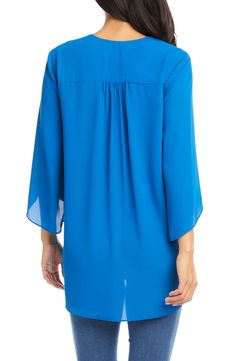 An elegant top of silky, lightweight crepe delivers elegant movement with its angled flare sleeves and fluttery asymmetrical hemline that dips low in back. 25 1/2" length (size Medium) V-neck Three-quarter sleeves Back yoke with gathering Crossover high/low hem 100% polyester Dry clean Made in the USA of imported fabric Women's Clothing Mediterranean Blue, Crepe Top, Flare Sleeves, Karen Kane, High Low Hem, Modest Outfits, Flared Sleeves, Three Quarter Sleeves, Three Quarter