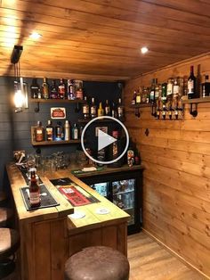 a bar with lots of liquor bottles on the wall