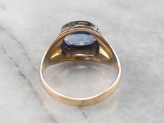 This sapphire ring makes a real statement on the hand! The sapphire is set in an east to west orientation and rises in a dramatic high profile design. The gold has a bright polish that shines beautifully next to the cornflower blue stone! Metal: 10K Yellow Gold Gem: Sapphire 4.46 Carats Gem Measurements: 8.3 x 10.3 mm, Oval Ring Size: 10.25 Marks: "10KA" Stamped on the inside band Mens Sapphire Ring, Sapphire Ring Vintage, Yellow Gold Sapphire Ring, Vintage Sapphire Ring, Band Metal, Vintage Sapphire, Gold Statement Ring, Oval Rings, Men's Ring