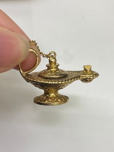 9ct Vintage Solid Yellow Gold Opening Magic Lamp Pendant 🔹Length - 30.5mm 🔹Weight - 8.9 grams  🔹Price - £465.00 All articles come presented in a gift box Classic Bronze Jewelry Gift, Classic Bronze Jewelry For Gifts, Antique Gold 14k Stamped Jewelry As Gift, Antique Gold Jewelry Stamped 14k As Gift, Gift Antique Gold Jewelry Stamped 14k, Classic Gold Jewelry With Gift Box, Gold Jewelry With Gift Box, Gold Jewelry With Gift Box For Keepsake, Gold Jewelry Keepsake With Gift Box