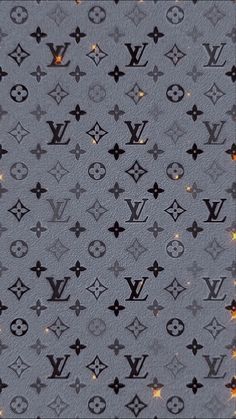 the louis vuitton pattern is shown in black and grey colors with gold stars