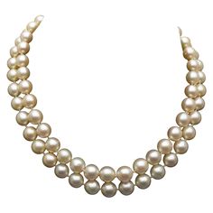 A classic and elegant double strand Akoya pearl neckace. The cultured Akoya pearls of cream color with rose overtones, and a gorgeous high luster. One strand consists of 37 pearls, the other 35. The pearls of nice size and shape, measuring 7.8 to 9.28 mm, round to near round. Necklace length is 15 inches with a 14K gold clasp embellished with a cabochon emerald, two cabochon rubies and four cabochon sapphires. Marked 14K on clasp. Total weight of necklace is 70.5 grams. An appraisal document by Luxury Classic Double Strand Necklace, Luxury Double Strand Jewelry With Faceted Beads, Luxury Double Strand Beaded Pearl Necklace, Luxury Beaded Double Strand Pearl Necklace, Formal Double Strand Pearl Necklace With Pendant, Luxury Double Strand Pearl Necklace For Formal Occasions, Luxury Double Strand Pearl Necklace, Double Strand Pearl Necklace For Formal Occasions, Elegant Single Strand Cream Pearl Necklace