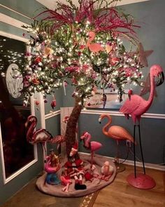 a christmas tree decorated with pink flamingos