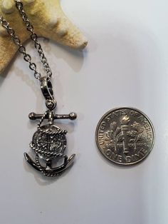 This beautiful piece is made from the silver recovered from the Atocha. It comes with a certificate stating that. The frame is solid sterling silver. This the mini version of the larger anchor coin I make. I also include a stainless steel chain with it. Key West Fl, Words To Describe, Silver Coins, Key West, Steel Chain, Stainless Steel Chain, Pendant Necklaces, Dog Tag Necklace, Coin