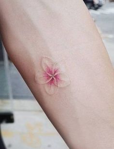 a small pink flower on the arm