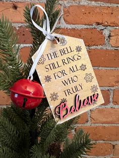 the bell still rings for all who truly believe ornament hanging on a christmas tree