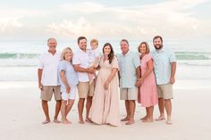 a family poses for a photo on the beach