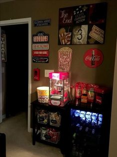 a living room filled with furniture and lots of signs on the wall next to it