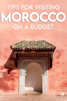 a pink building with the words tips for visiting morocco on a budget written in white