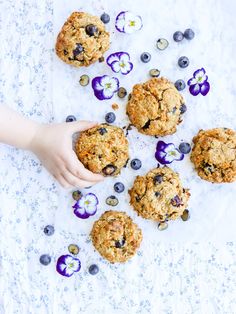 blueberry oatmeal breakfast cookies on a white tablecloth with flowers around them