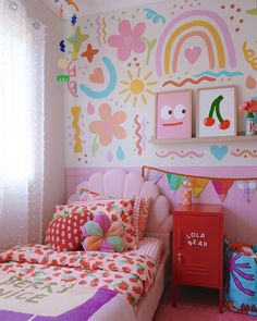 a child's bedroom decorated in bright colors