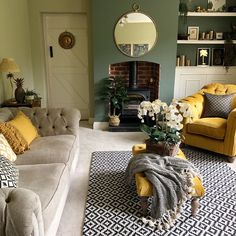 a living room filled with furniture and a fire place