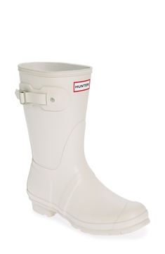 Comfort and quality combine in a classic waterproof boot complete with a removable insole and ground-gripping sole. 1" heel 10" shaft Waterproof: protects against rain, puddles and slush to keep feet dry in wet conditions Adjustable buckle side tab Removable insole In hot or humid weather, natural latex rubber releases a protective wax film; simply wipe it off with a damp cloth Rubber upper/textile lining/rubber sole Imported Classic Waterproof Rain Boots With Round Toe, White Weatherproof Rain Boots For Outdoor, Classic Waterproof Rain Boots, Classic Waterproof Rain Boots For Rainy Weather, White Waterproof Outdoor Boots, Classic Round Toe Boots For Rainy Weather, Durable Round Toe Boots For Rainy Weather, Rain Boots Women, Humid Weather