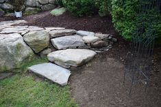 there is a rock wall in the yard