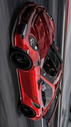 an aerial view of a red sports car