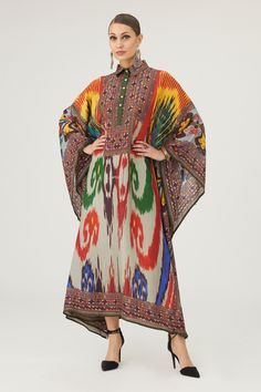 Multi color kaftan crafted in silk base with abstract print.
Components: 1
Pattern: Print
Type Of Work: Abstract
Neckline: Collared Neck
Sleeve Type: Batwing Sleeves
Fabric: Silk
Color: Multi Color
Other Details: 
Geometric print placket and edges
Half button closure
Occasion: Resort - Aza Fashions Bohemian Designer Kaftan For Summer, Bohemian Designer Summer Kaftan, Elegant Multicolor Digital Print Kurta, Silk Kurta With Digital Print In Tunic Shape, Silk Kurta With Digital Print In Tunic Style, Elegant Multicolor Printed Motifs Kurta, Elegant Multicolor Kurta With Printed Motifs, Elegant Multicolor Printed Kurta, Elegant Kaftan With Printed Motifs And Kimono Sleeves