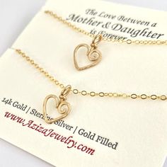 This Hearts Necklace Set is just for your favorite mother-daughter duo. These matching heart necklaces make the bond between mother and daughter even more special. "The love between a mother and daughter is forever."Select your desired metal from the drop down menu- SS- sterling silver, 14kGF- 14k gold filled or 14kRGF- 14k rose gold filled.Two swirly heart necklaces are hand formed from thick wire into the shape of hearts and then hammered for texture and shine. The larger heart measures about Heart Pendant Charm Necklace For Birthday And Mother's Day, Gold Double Heart Necklace For Birthday, Open Heart Necklace For Mother's Day And Birthday, Open Heart Necklace For Birthday And Mother's Day, Double Heart Charm Necklace For Mom, Valentine's Day Double Heart Charm Necklace For Mom, Double Heart Necklace For Mother's Day Birthday, Double Heart Necklace With Heart Charm For Mother's Day, Double Heart Necklace For Anniversary And Mother's Day