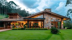 a large house sitting on top of a lush green field