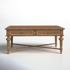 a wooden table with two drawers on one side and an open drawer on the other