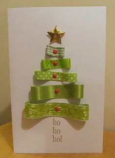 a christmas card with a green ribbon and a gold star on top that says, no ho hoi