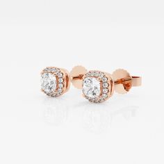 Soft cushion shaped lab grown diamonds are encompassed with smaller scintillating round diamonds in this halo styled stud earring pair. Whether you plan to wear it to work or to a brunch party with friends, these are sure to be attention-grabbers. Fine Jewelry Rose Gold Halo Diamond Earrings, Rose Gold Diamond Earrings With Halo, Formal Rose Gold Cluster Earrings With Halo Design, Rose Gold Diamond Halo Earrings, Rose Gold Halo Diamond Earrings, Rose Gold Diamond Earrings With Halo Setting, Formal Rose Gold Halo Diamond Earrings, Classic Rose Gold Diamond Earrings With Halo Design, Classic Rose Gold Earrings With Halo Setting