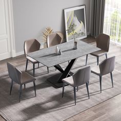 a dining room table with six chairs and a vase on the table in front of it