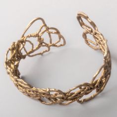 Hand woven wire bracelet cast in sterling silver finished in 14K gold. This one of a kind, rigid and lightweight cuff is a sculpture for your arm. Unique Gold Cuff Bracelet With Intricate Design, Gold Cuff Bracelet, Gold Bracelet Cuff, Gold Cuffs, Wire Bracelet, Cuff Bracelet, Hand Woven, Gold Bracelet, Hand Weaving