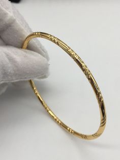 18k Gold Filled Adult Size Bangle PLEASE NOTE THIS LISTING IS FOR 1 BANGLE Adult Size 2.8 Inside Diameter of 6.5cm Weight 12grams External Width 3mm VELVET CASE SUPPLIED Is This Piece Made Of Solid Gold? No. The item is Gold Filled , used to describe a specific form of gold plating, does not, as the term implies, mean that the item is filled with gold. Looks identical to real gold. It refers to Jewellery made of base metal (commonly brass or copper) covered by sheets of gold bonded to the base b Copper Bangles Gold, Real Gold Bangles, Daily Use Gold Bangles Indian, Orientalism Art, Gold Thumb Rings, Solid Gold Bangle, Gold Bangles Indian, Gold Jewelry Outfits, Bangles Gold