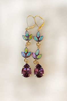 "Gorgeous pair of long, dangly earrings featuring crystals in eggplant purple and vintage crystals in purple with a shimmery finish. 2 7/8\" long. Available in gold, rose gold or silver metal finishes. Shown in gold. Thanks for stopping by!" Plum Bridesmaid, Earrings Chandelier, Repurposed Jewelry, Eggplant Purple, Etsy Bridesmaid Gifts, Purple Earrings, Purple Crystal, Earrings Crystal, Bridal Bracelet