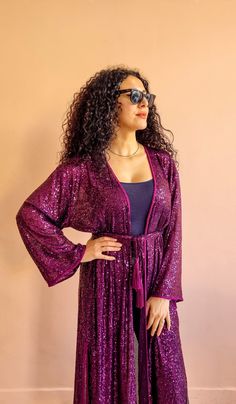 Gorgeous sequin Kimono fully handmade in Morocco with handmade silk trimmings. It comes with a belt designed with handmade silk pompom. DETAILS Sequin One size fits all This is a very loose top. The model wears Small Handmade in Morocco. Got a question!! don't hesitate to contact me :) Long Sleeve Purple Party Kaftan, Bohemian Sequin Kaftan For Parties, Long Sequined Kaftan For Party, Moroccan Kimono, Sequin Kimono, Loose Top, Belt Design, Oversized Dress, Dress Gift