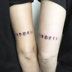 two people with matching tattoos on their arms, each showing different phases of the moon