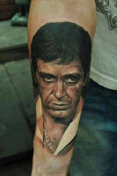 a man's arm with a portrait on it