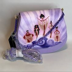 a purple purse with an image of three women on it