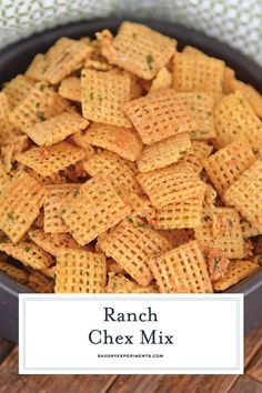 ranch chex mix in a black bowl on top of a wooden table with the title overlay