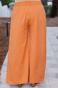 All eyes will be on you in these FAB pants! Perfect for a resort trip or brunch date, these papaya colored pants will elevate your style with their flattering flare design! The elastic waistband adds comfort to functionality, ensuring a perfect fit for any occasion! 55% Hemp, 45% Polyester Orange Summer Loungewear Bottoms, Casual Peach Pants For Spring, Summer Wide-leg Bottoms For Brunch, Peach Wide Leg Bottoms For Spring, Casual Peach Bottoms For Summer, Orange Summer Loungewear Pants, Peach Bottoms For Spring Vacation, Casual Peach Wide Leg Bottoms, Orange Pants For Summer Loungewear