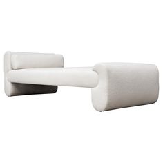 two white couches sitting next to each other