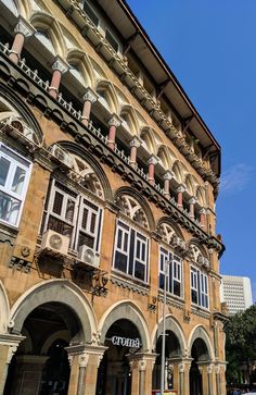 an old building with arched windows and arches on the front is shown in this photo