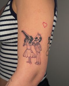 a woman with a tattoo on her arm