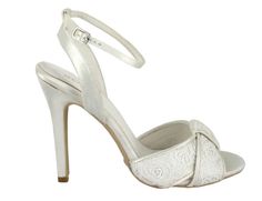 a women's white high heeled shoe with an intricate design on the ankle